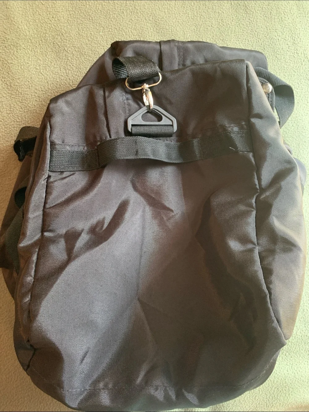 EUC black nylon duffel bag with strap. Approximately 22” x 14” x 10.5”